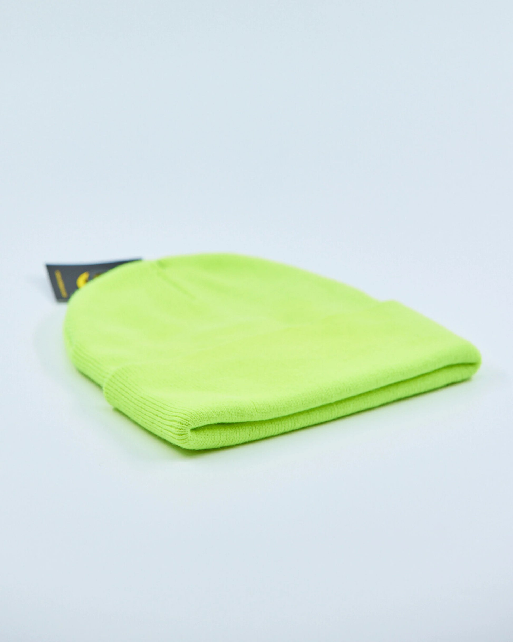 Neon green beanie on a light gray background
