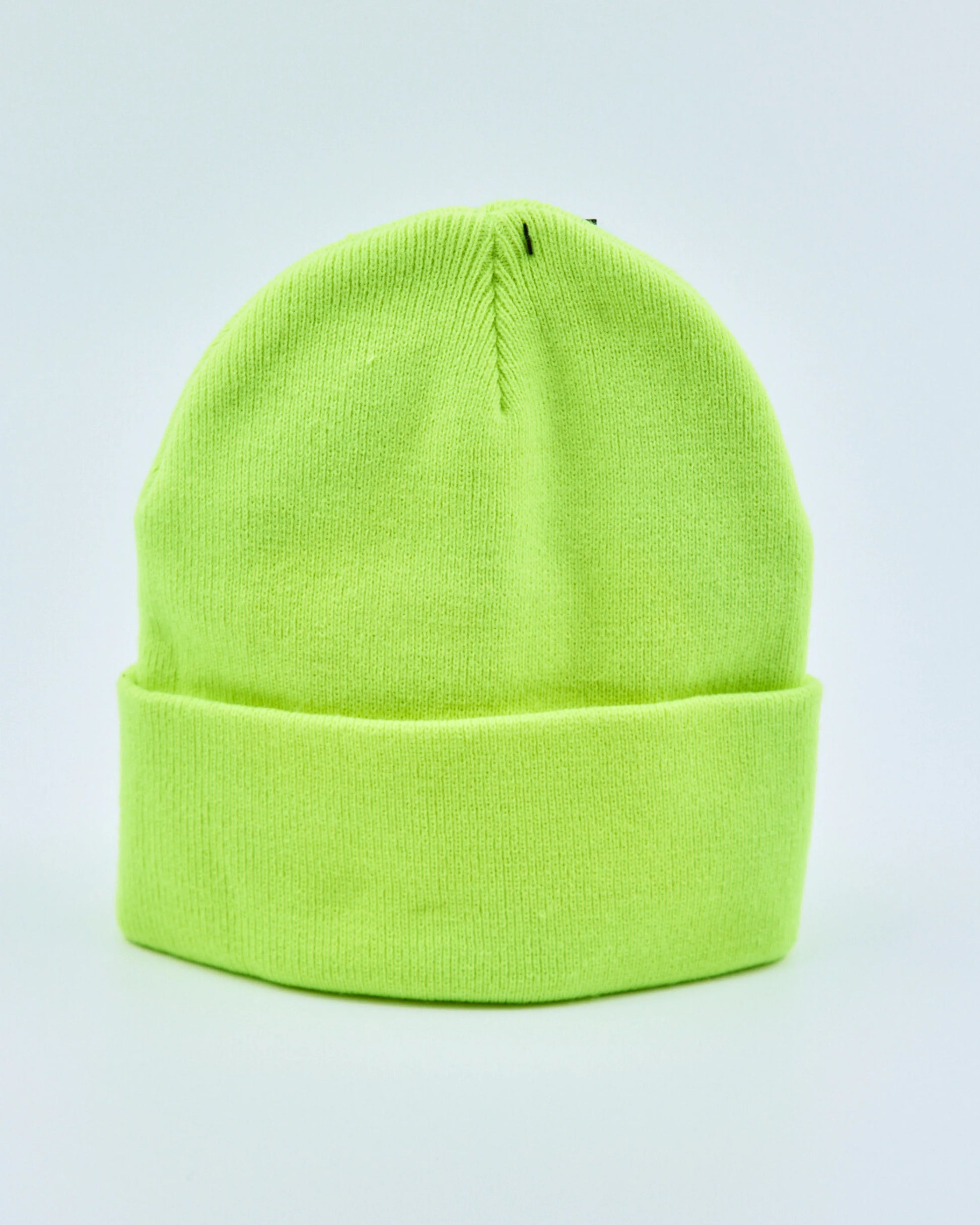 Neon green beanie on a light gray background