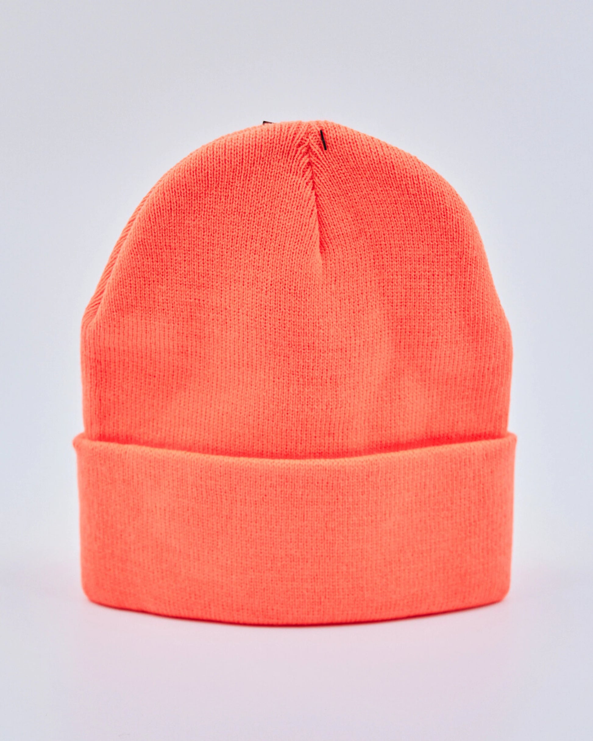 Neon orange beanie on a light gray background