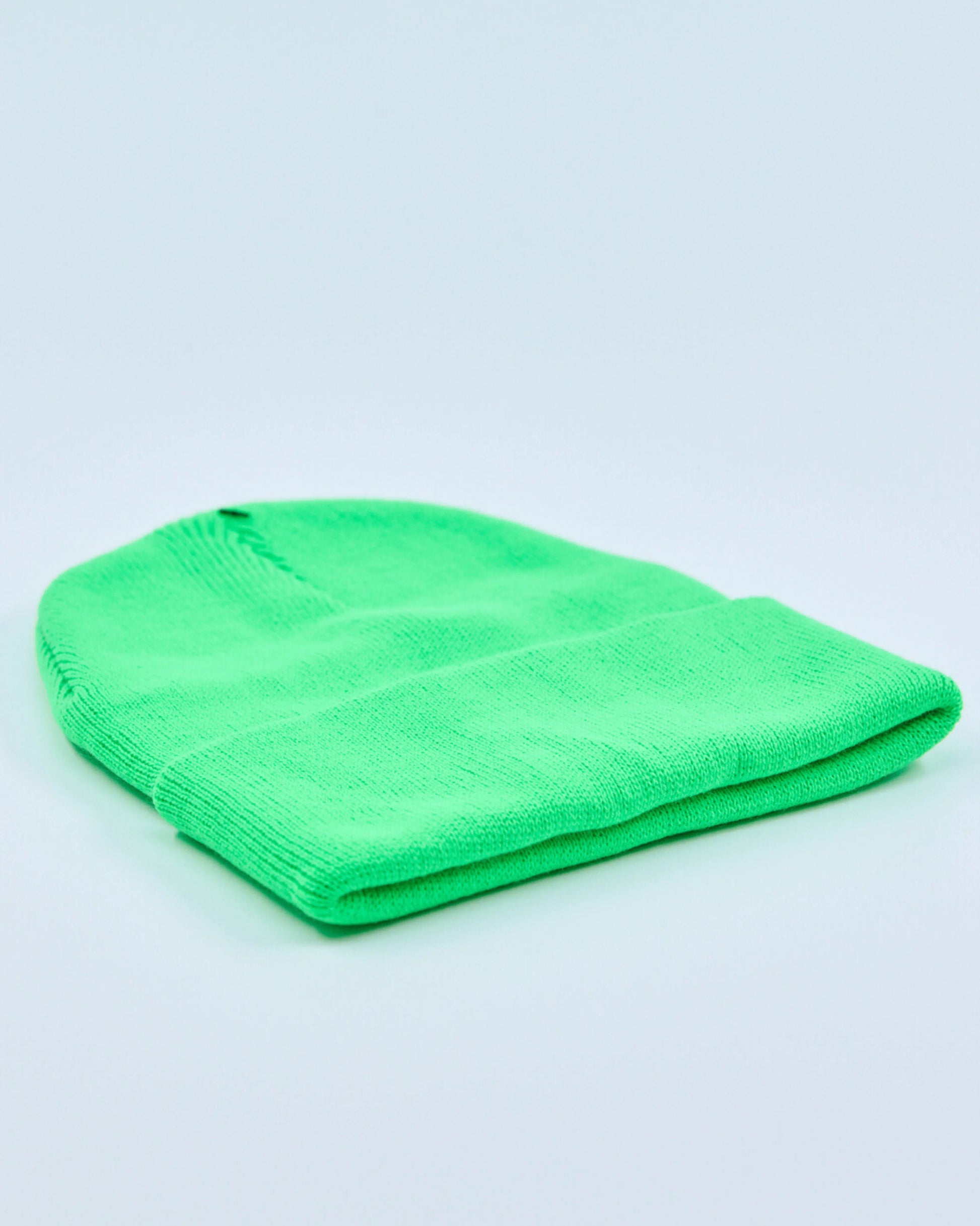 Screaming green beanie on a light gray background