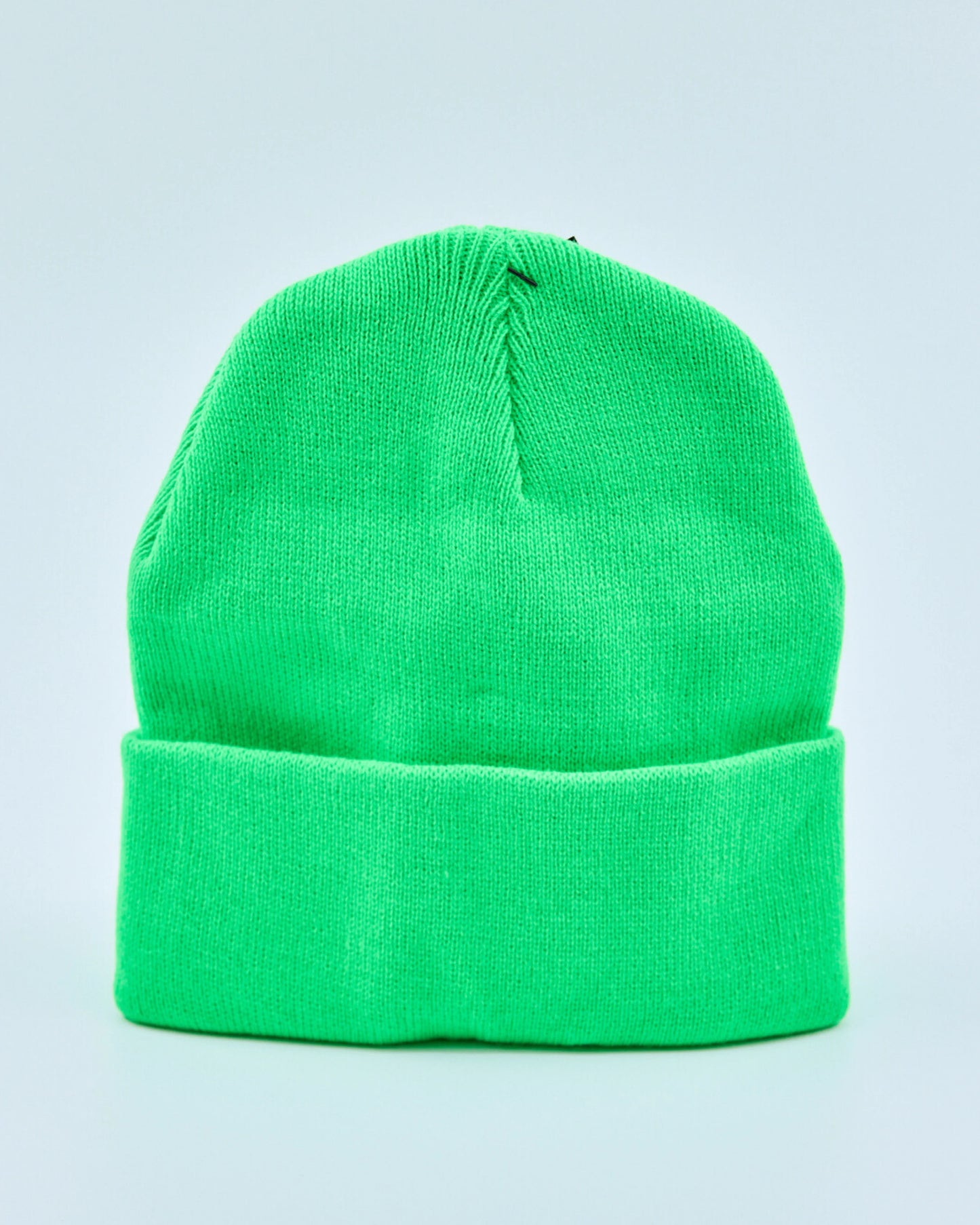 Screaming green beanie on a light gray background