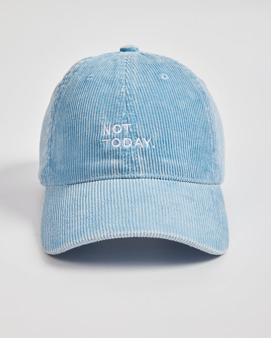 Blue corduroy cap with 'Not Today' text on a light gray background