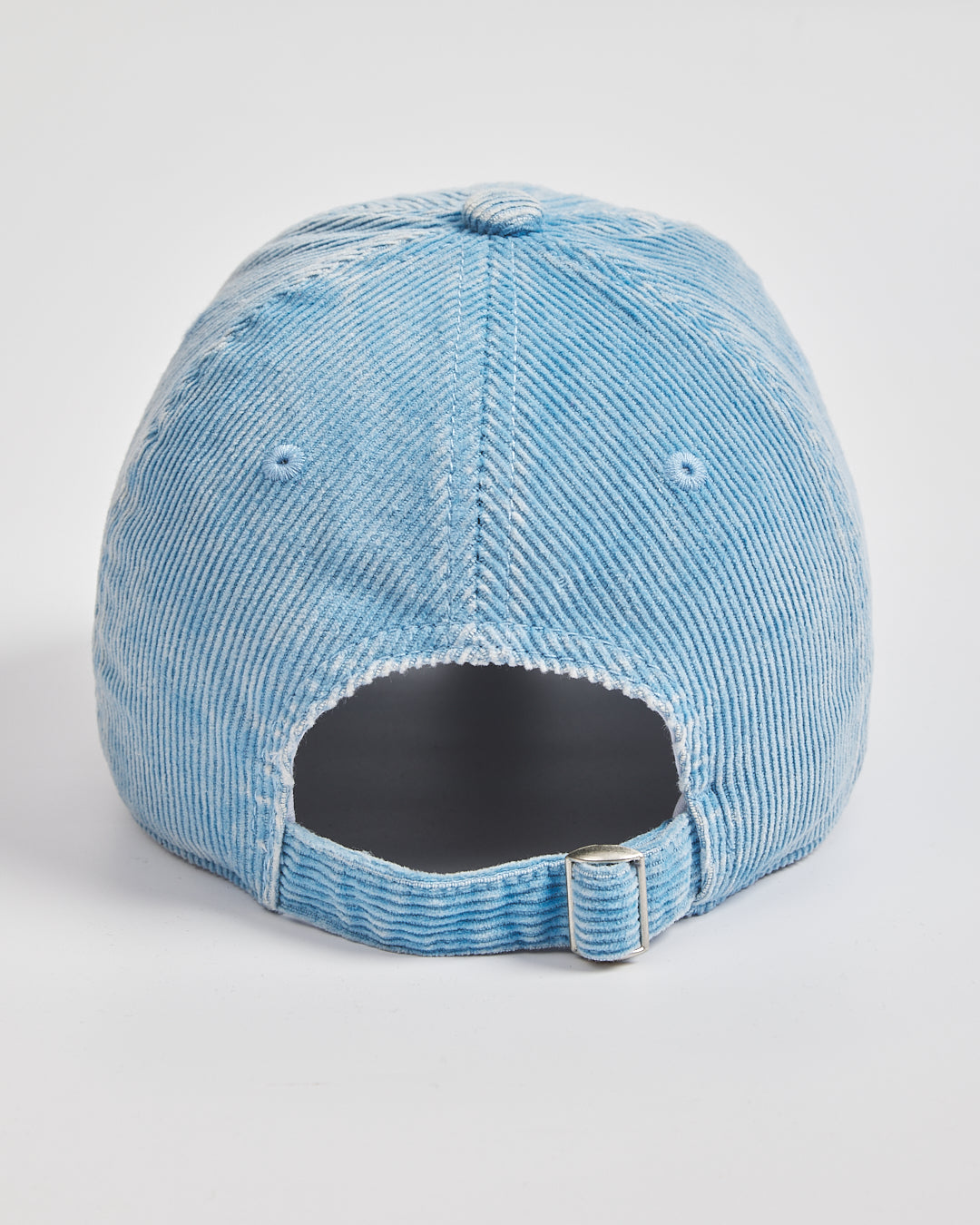 Blue denim cap on a white background