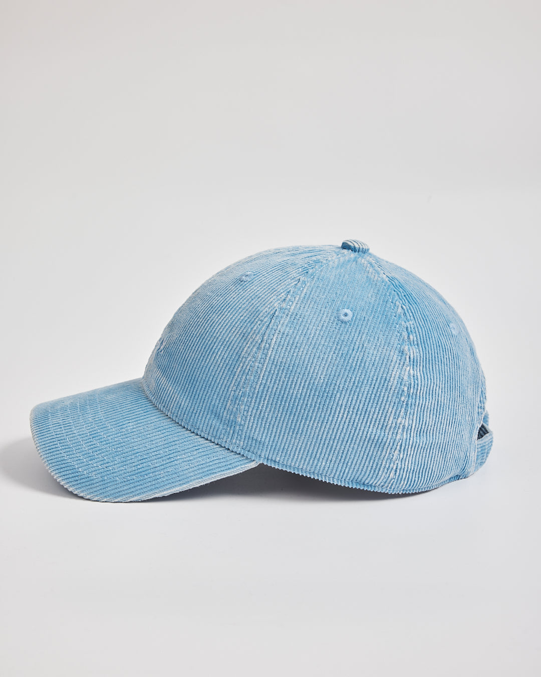 Blue denim cap on a light gray background