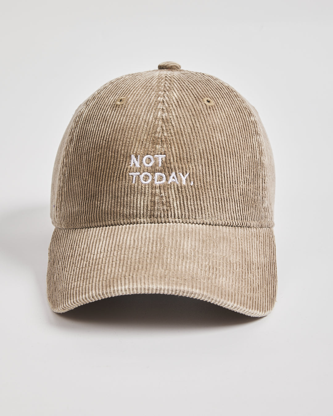 Beige cap with 'Not Today' text on a light gray background