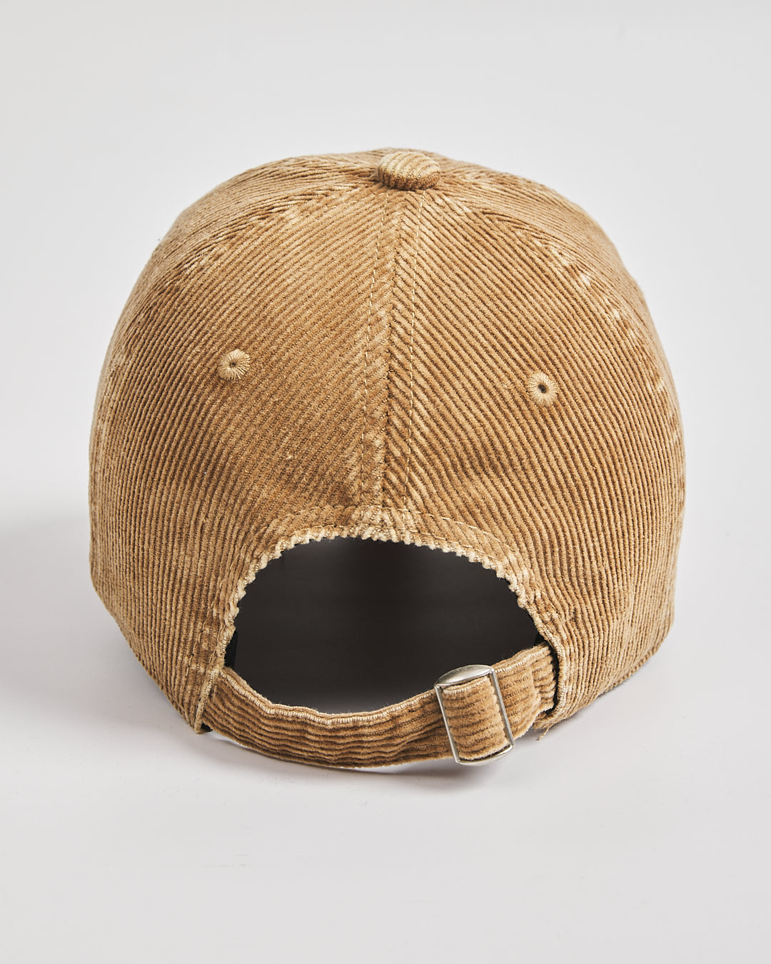 Camel corduroy cap on a light gray background