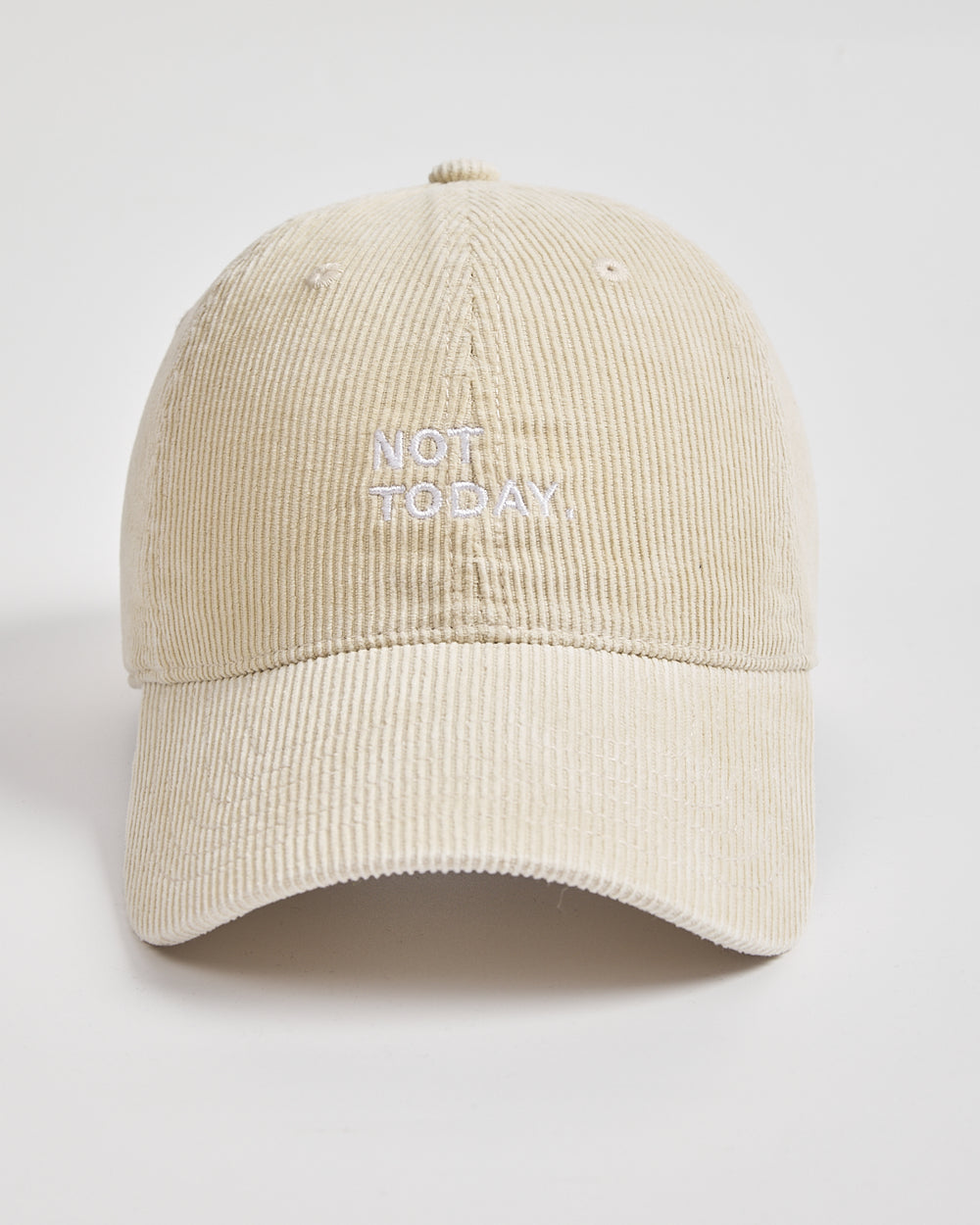 Cream cap with 'NOT TODAY' text on a light gray background