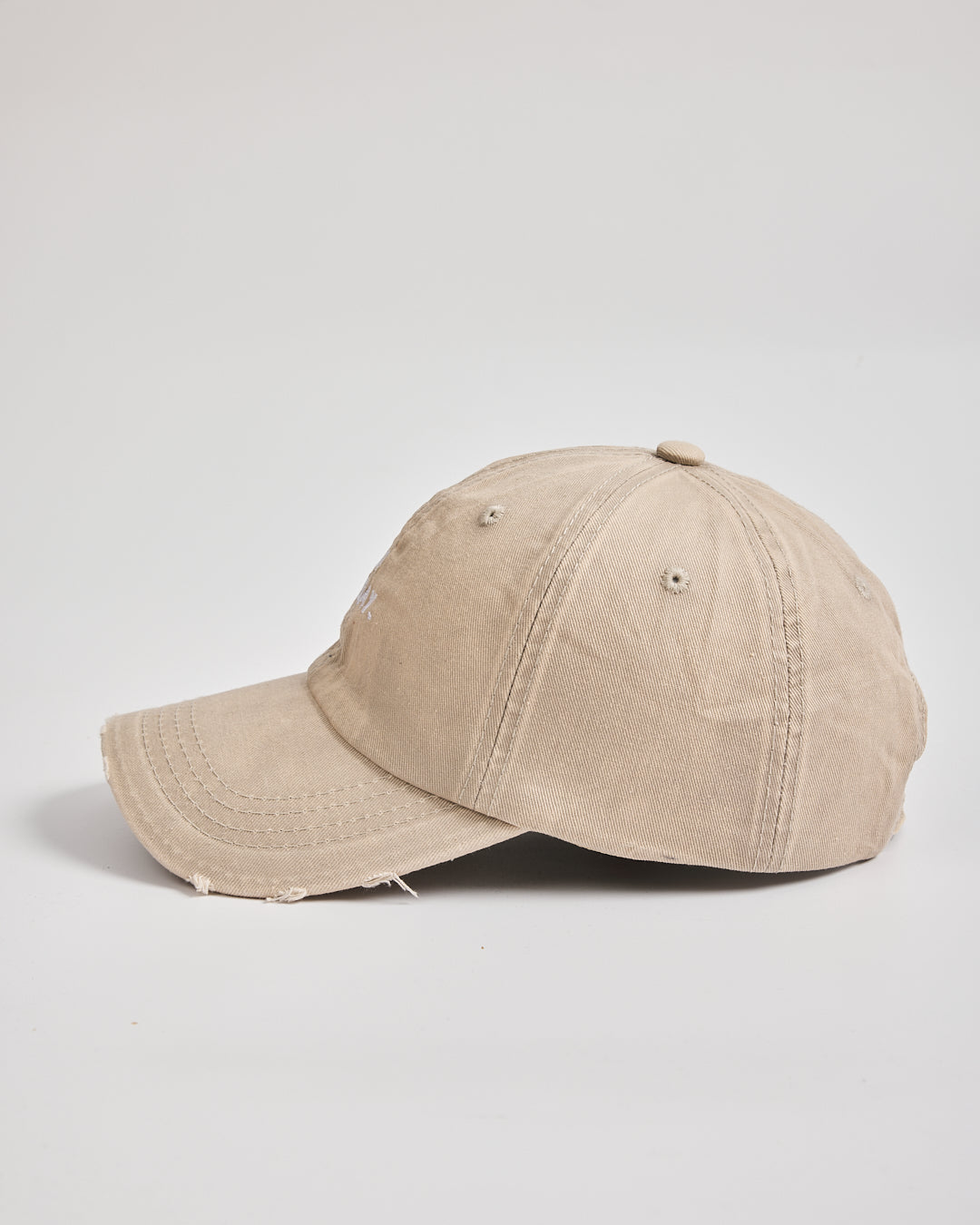 Beige baseball cap on a light gray background
