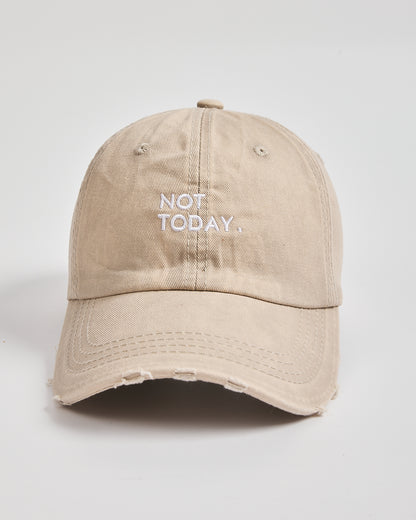 Beige cap with 'Not Today' text on a light gray background