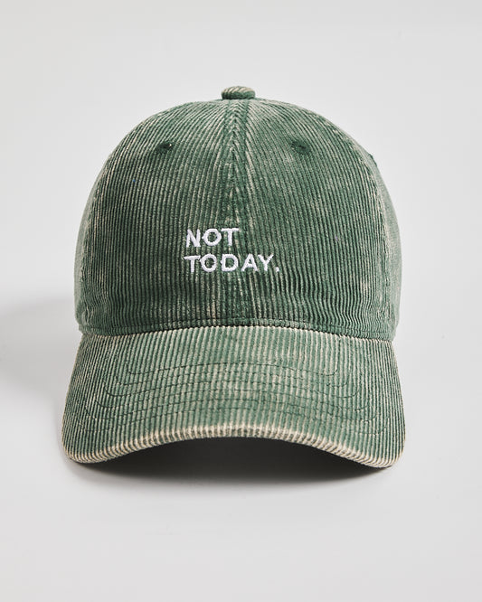 Green corduroy cap with 'Not Today' text on a light gray background