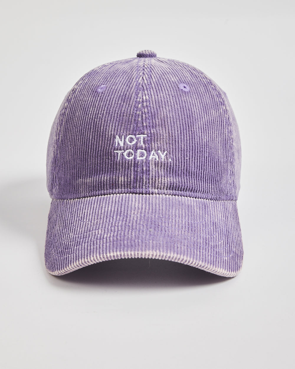 Purple corduroy cap with 'Not Today' text on a light gray background