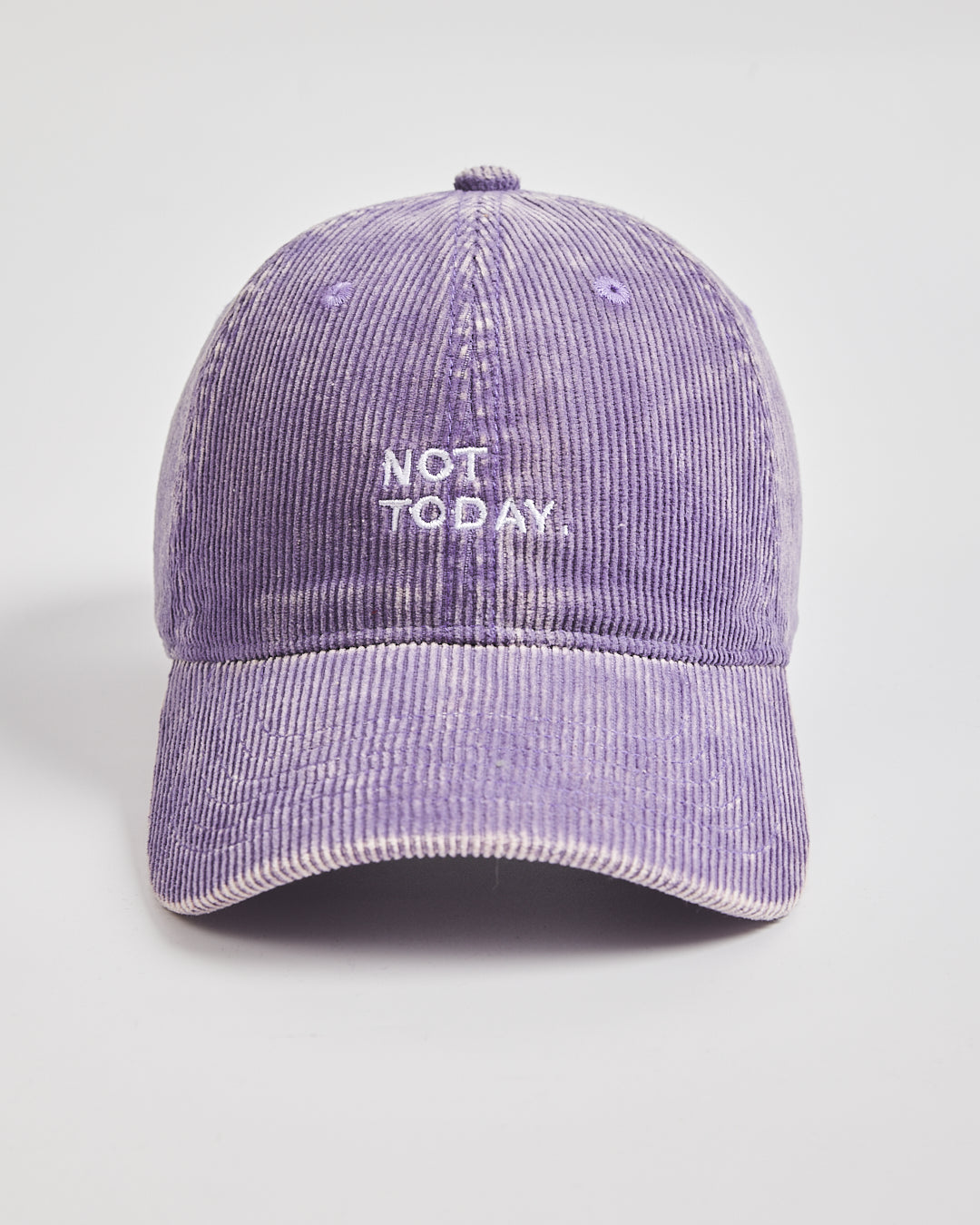 Purple corduroy cap with 'Not Today' text on a light gray background