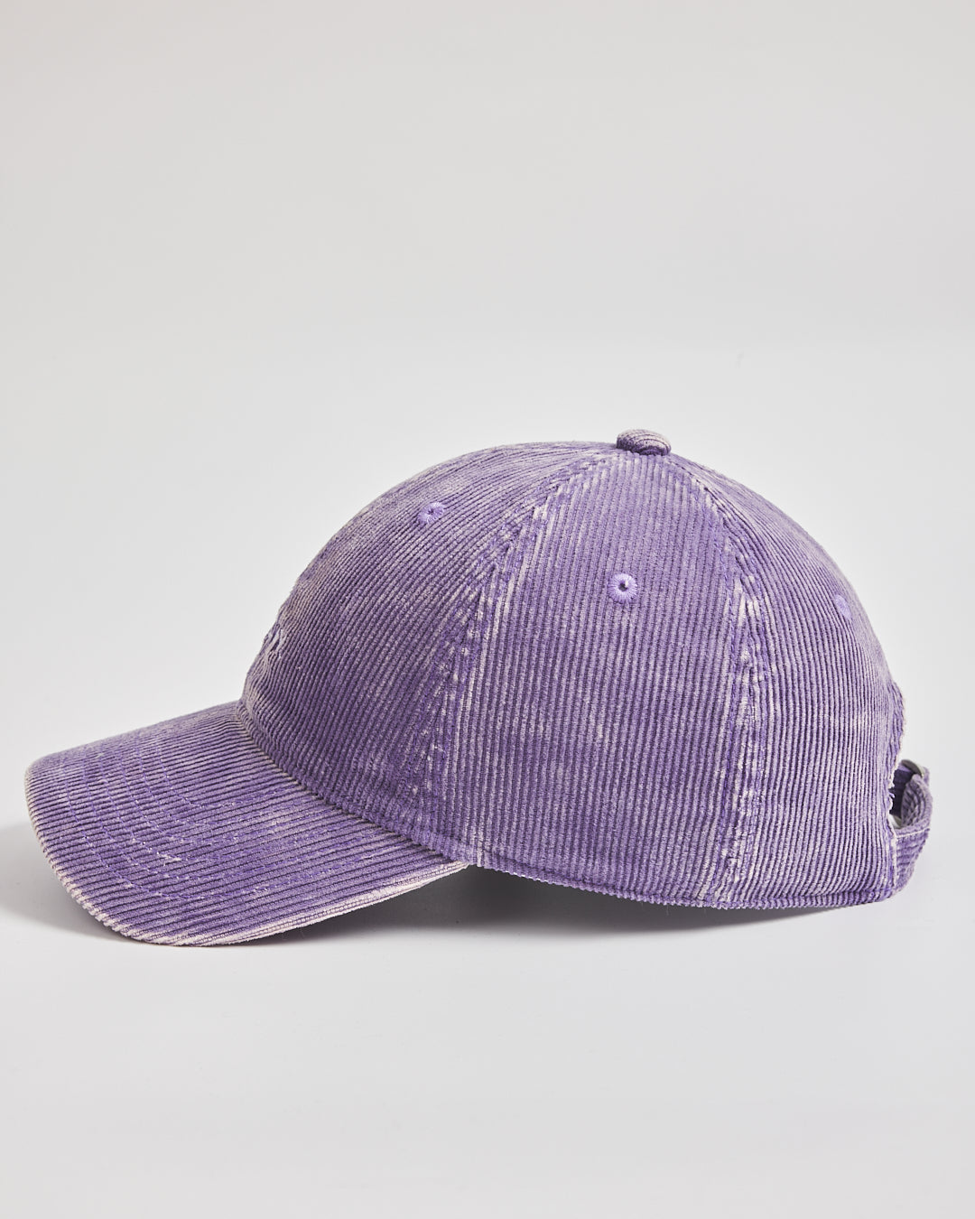 Purple corduroy cap on a light gray background