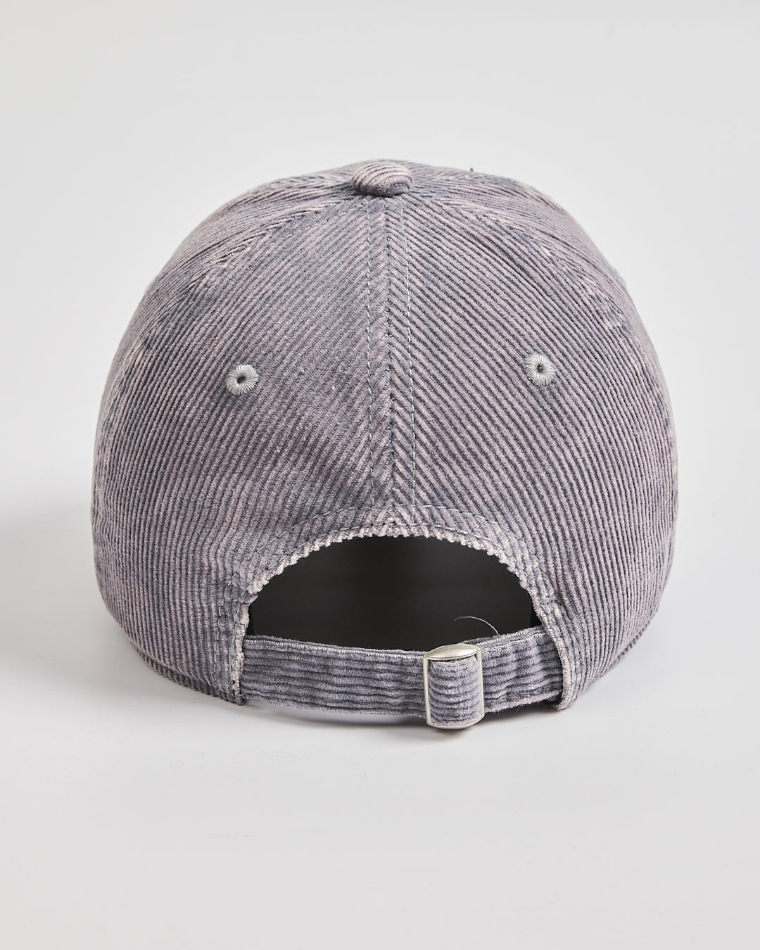 Gray corduroy cap on a light gray background