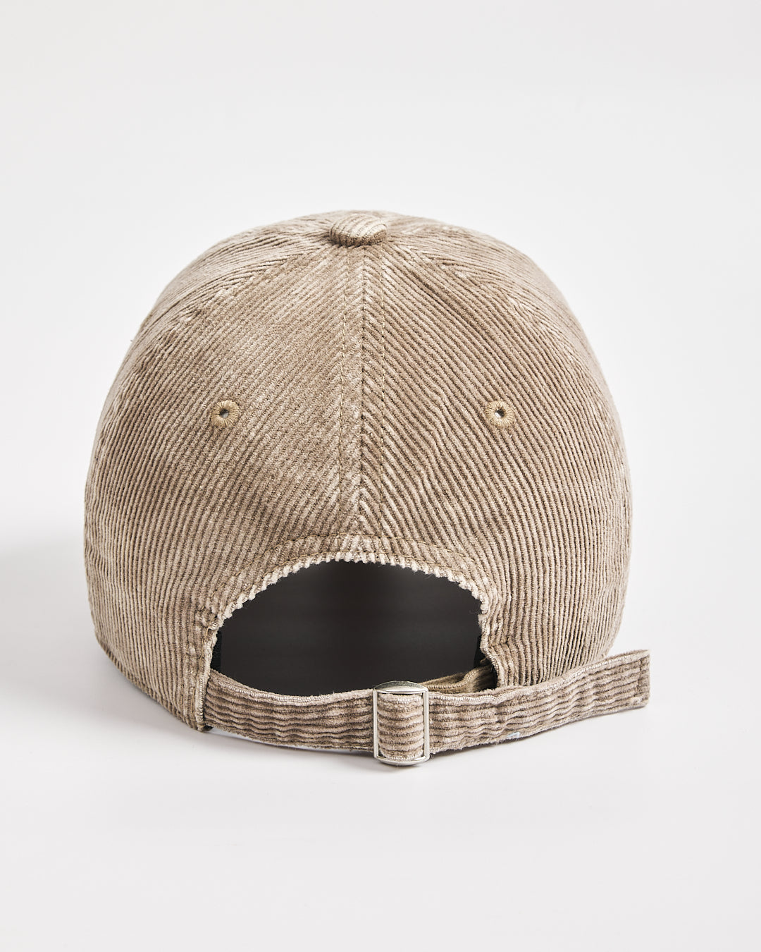 Beige corduroy cap on a white background