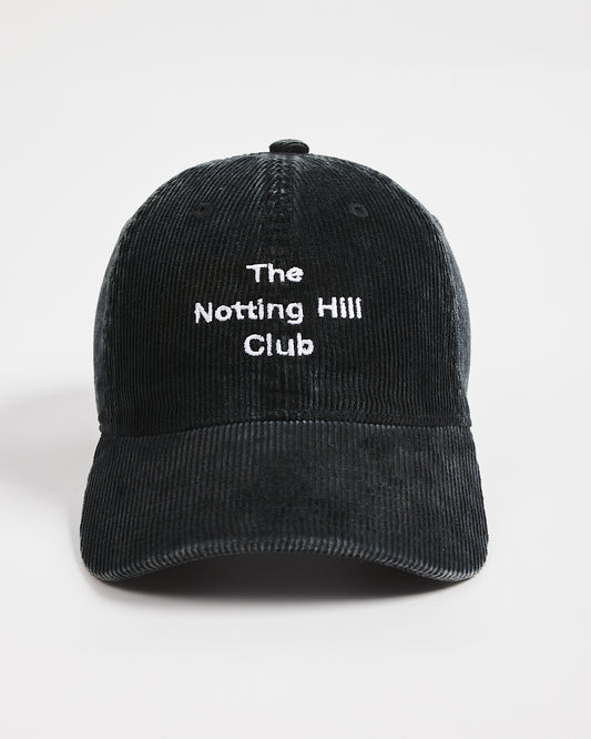 Black cap with 'The Notting Hill Club' text on a white background