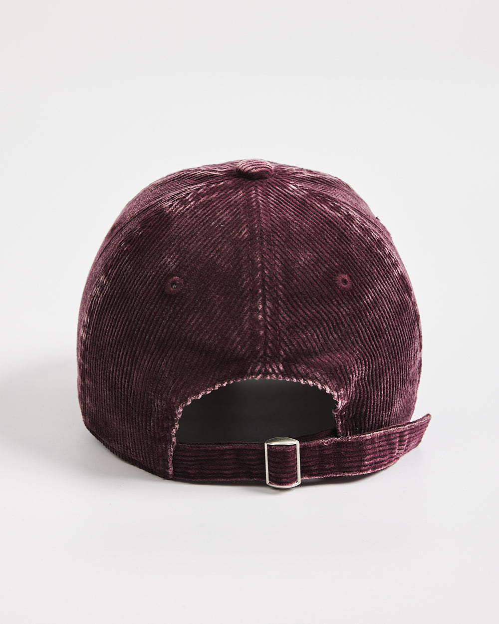 Maroon corduroy cap on a white background