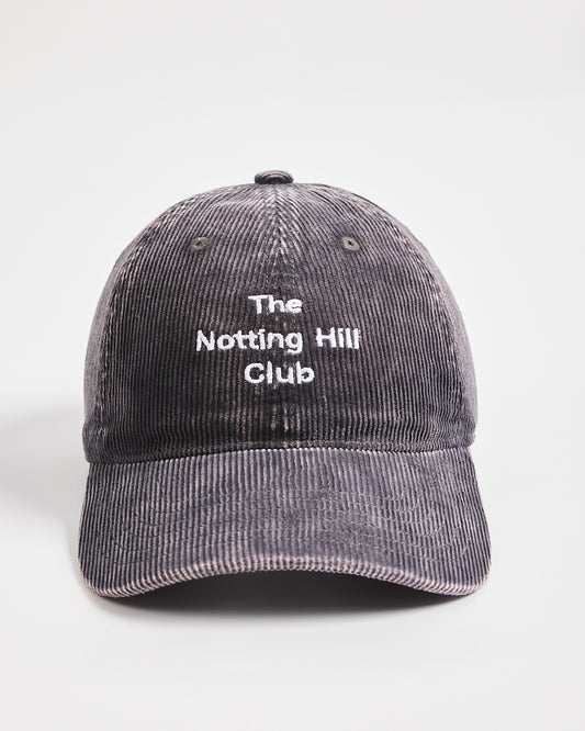 Gray cap with 'The Notting Hill Club' text on a white background