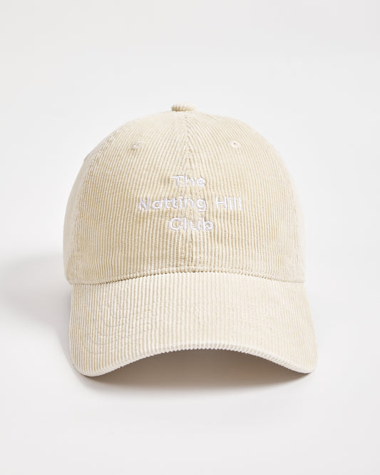 Cream cap with text on a light gray background