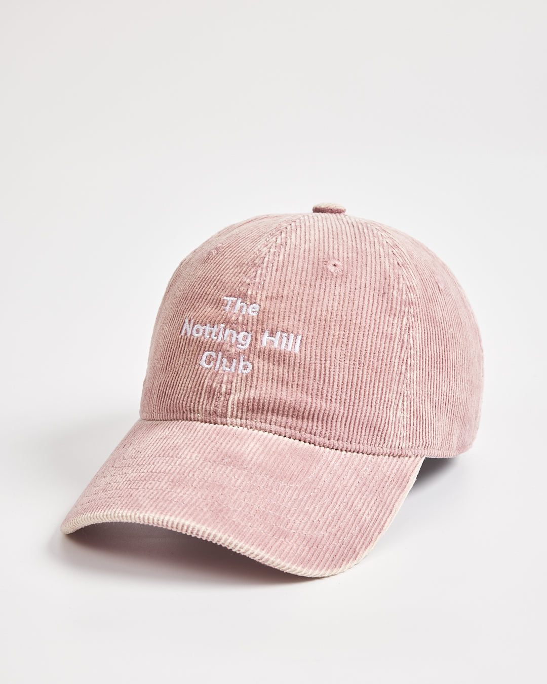 Pink cap with 'The Notting Hill Club' text on a light gray background
