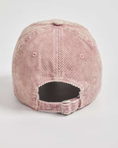 Pink corduroy cap on a light gray background