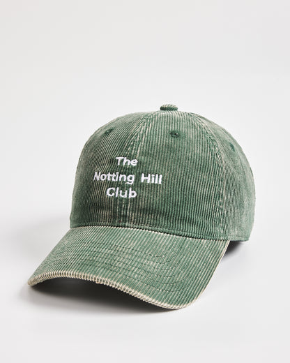 Green cap with 'The Notting Hill Club' text on a white background