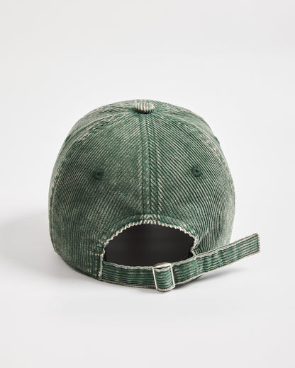 Green corduroy cap on a white background