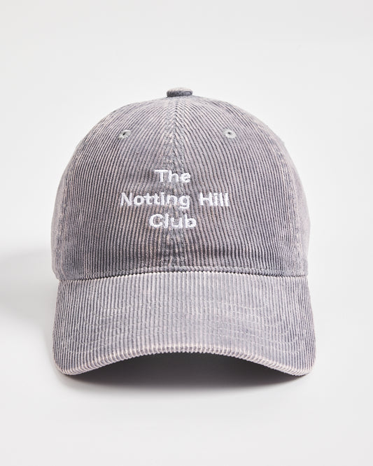 Gray cap with 'The Notting Hill Club' text on a light gray background