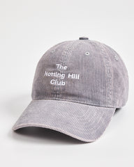 Gray corduroy cap with 'The Notting Hill Club' text on a white background