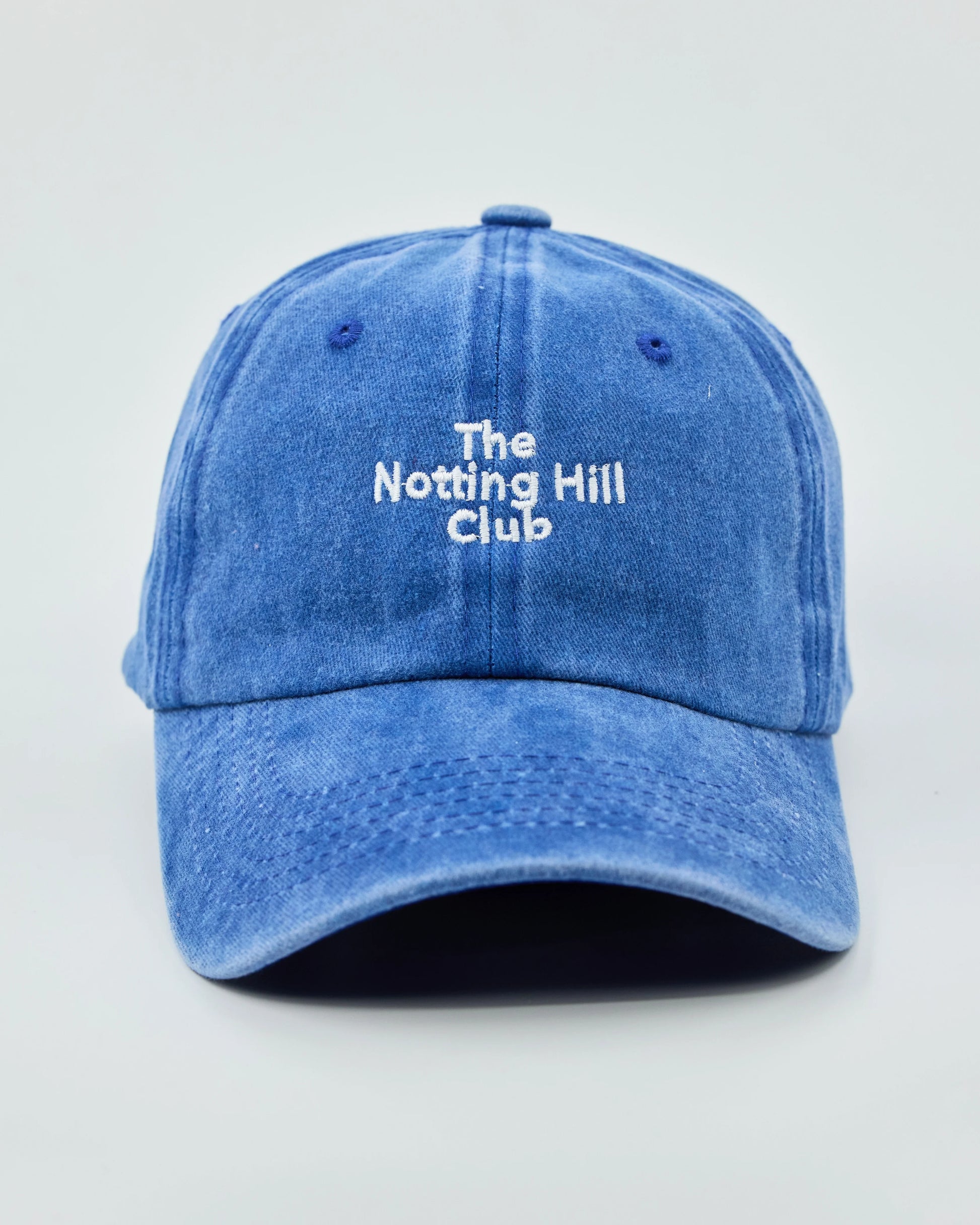 Front view of The Notting Hill Club Blue Washed Cap