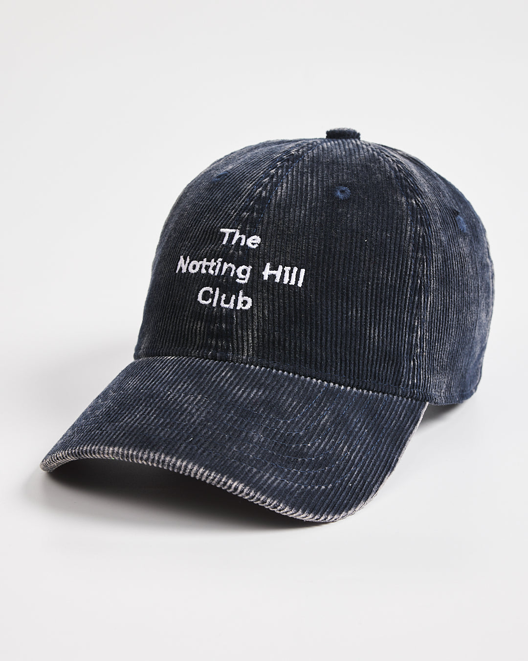 Navy cap with 'The Notting Hill Club' text on a white background