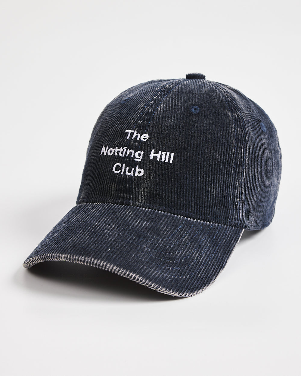 Navy cap with 'The Notting Hill Club' text on a white background