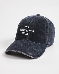Navy cap with 'The Notting Hill Club' text on a white background