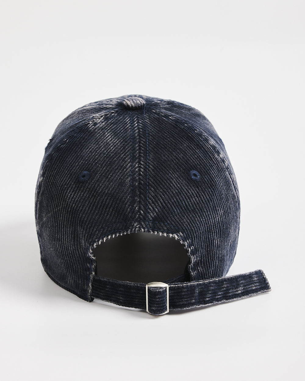 Navy distressed baseball cap on a white background