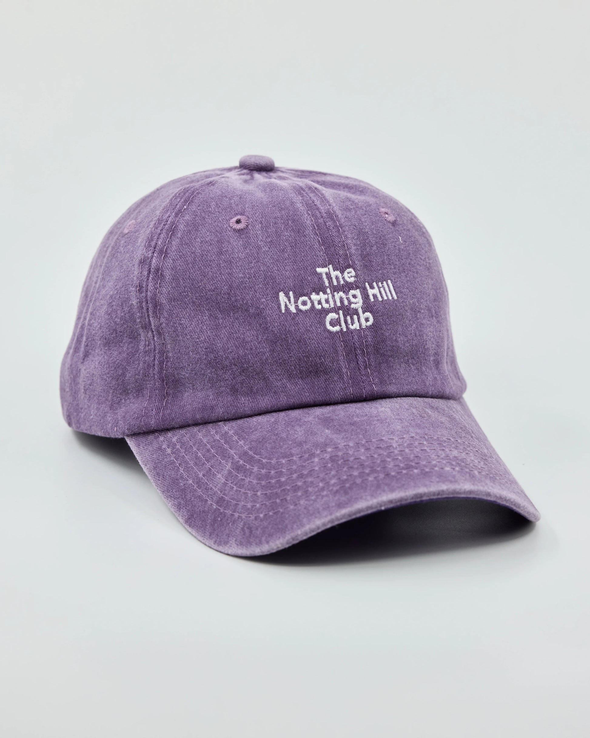 Side view of The Notting Hill Club Purple Washed Cap