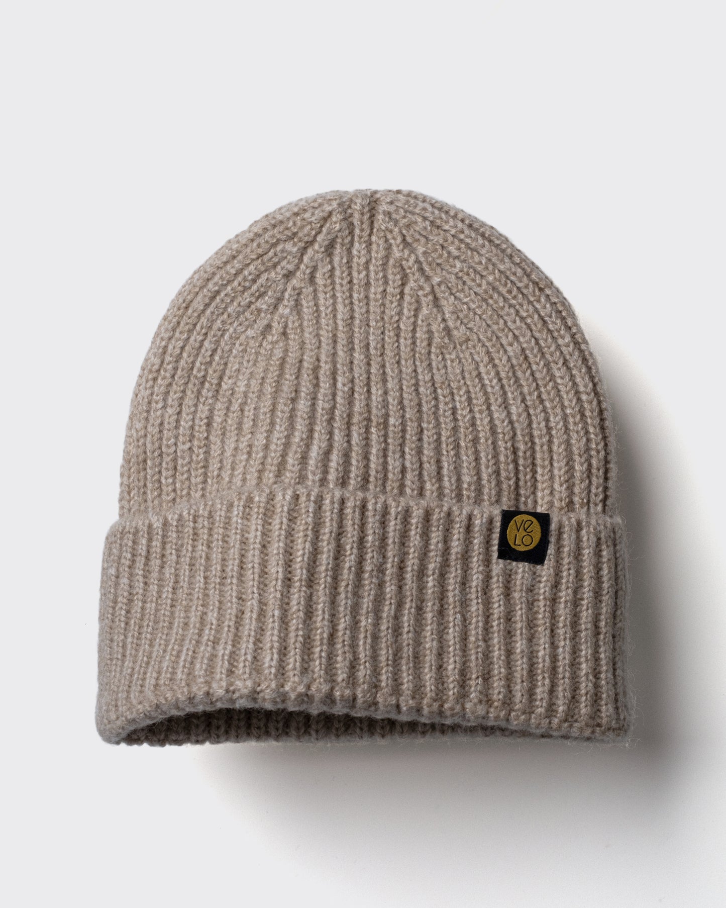Oatmeal Lux Beanie on a light gray background