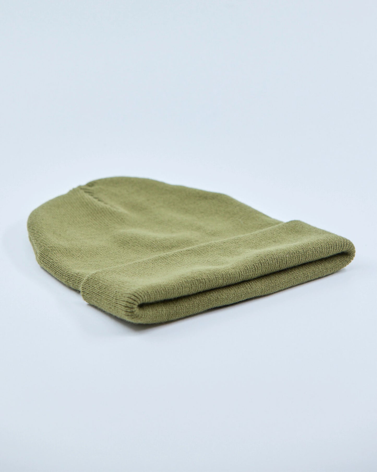 Olive beanie on a light gray background