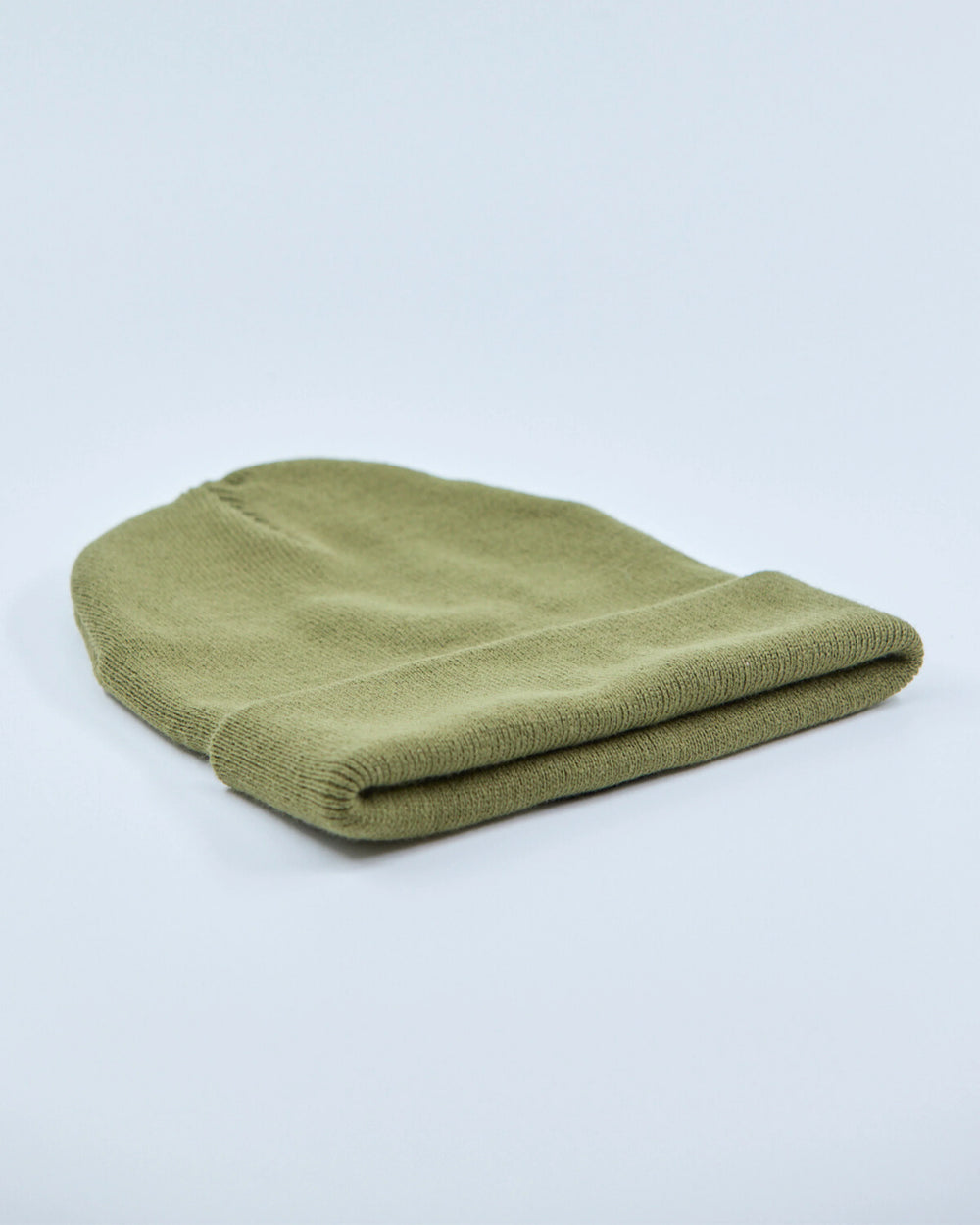 Olive beanie on a light gray background