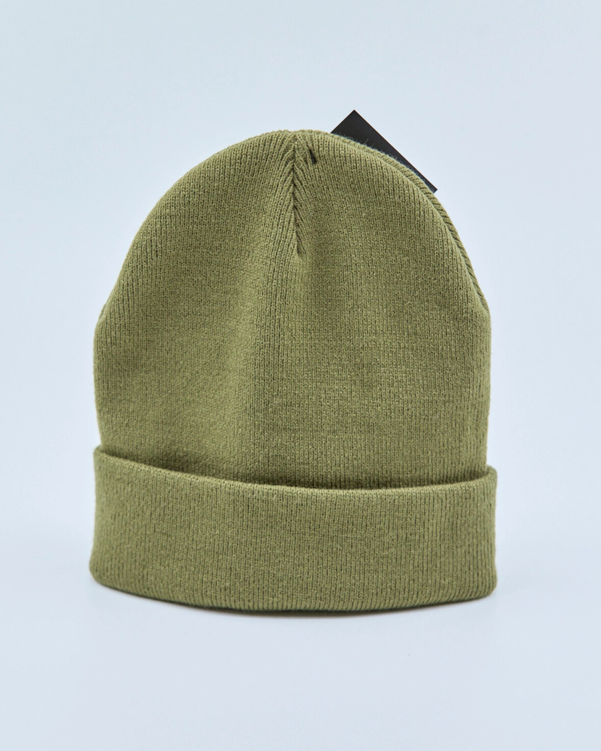 Olive green beanie on a light blue background