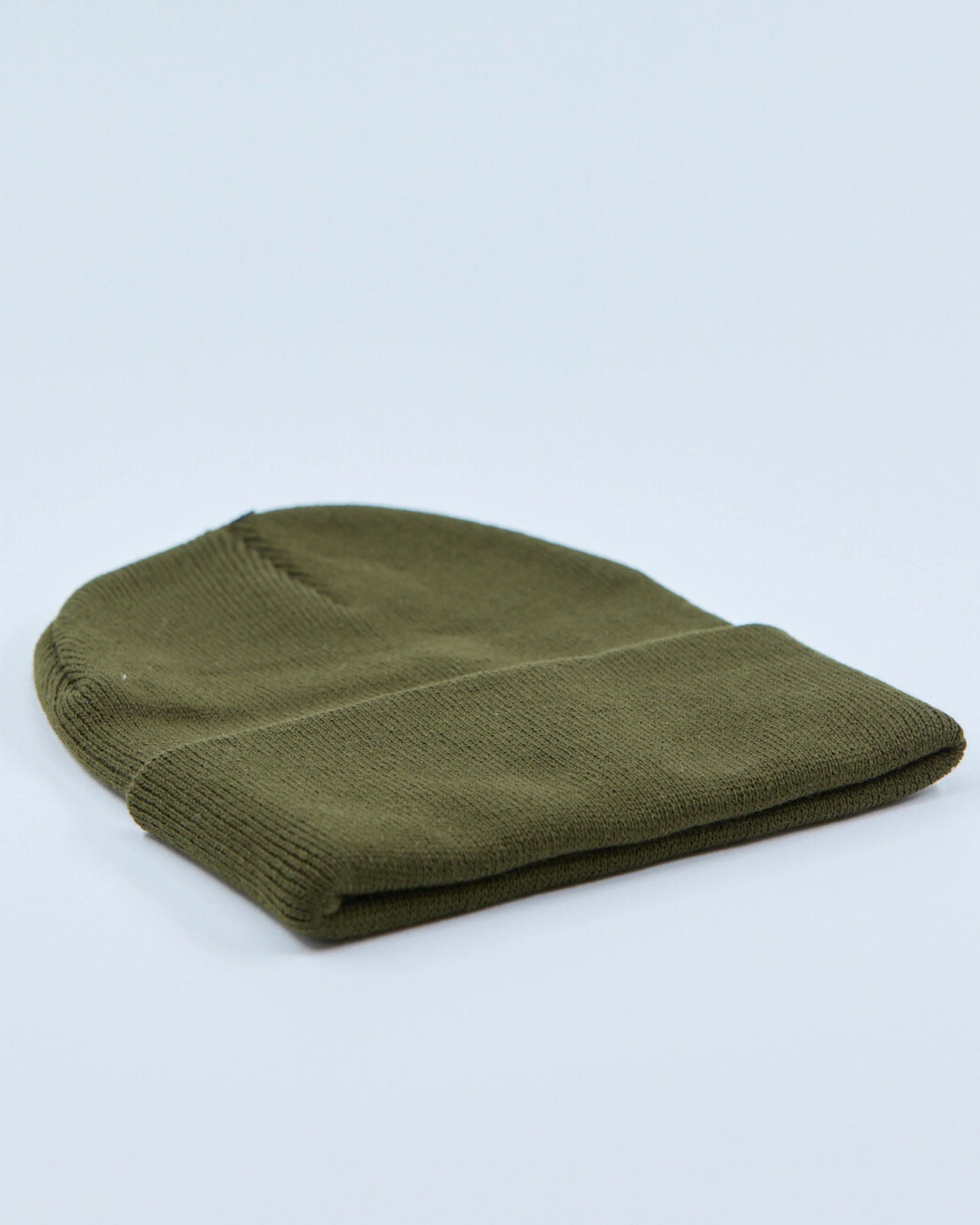 Olive green beanie on a light gray background