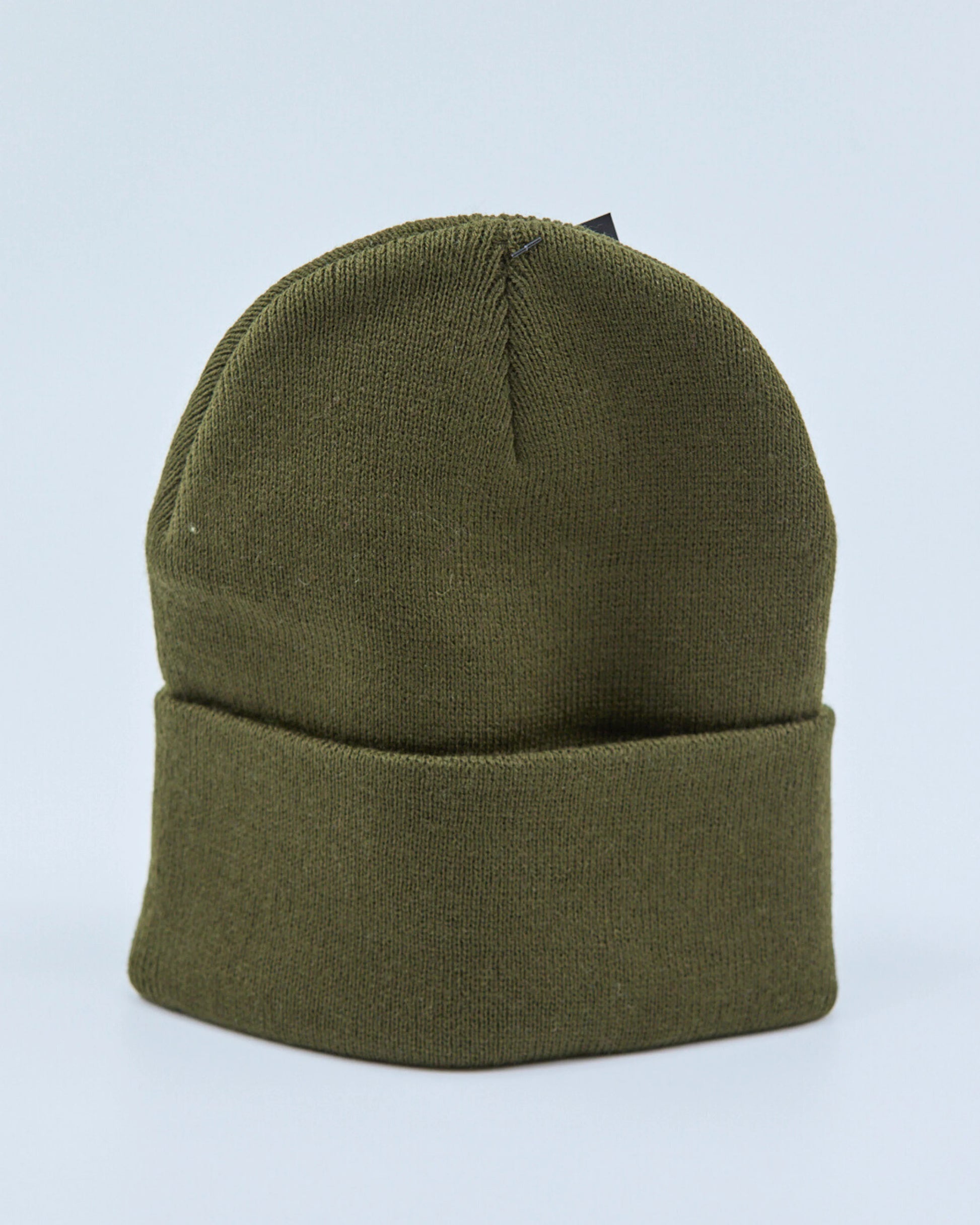Olive green beanie on a light blue background