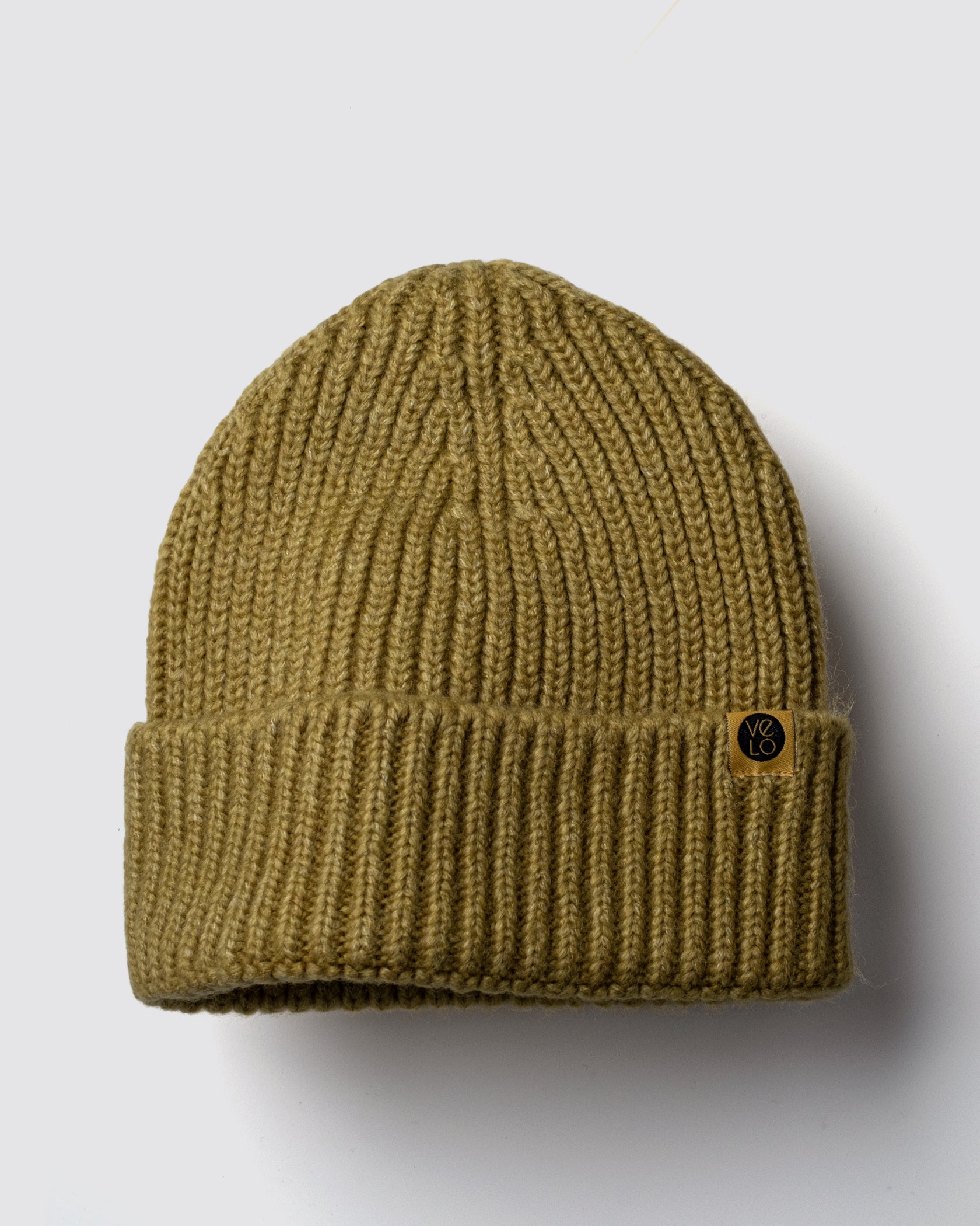 Olive Lux Beanie on a light gray background