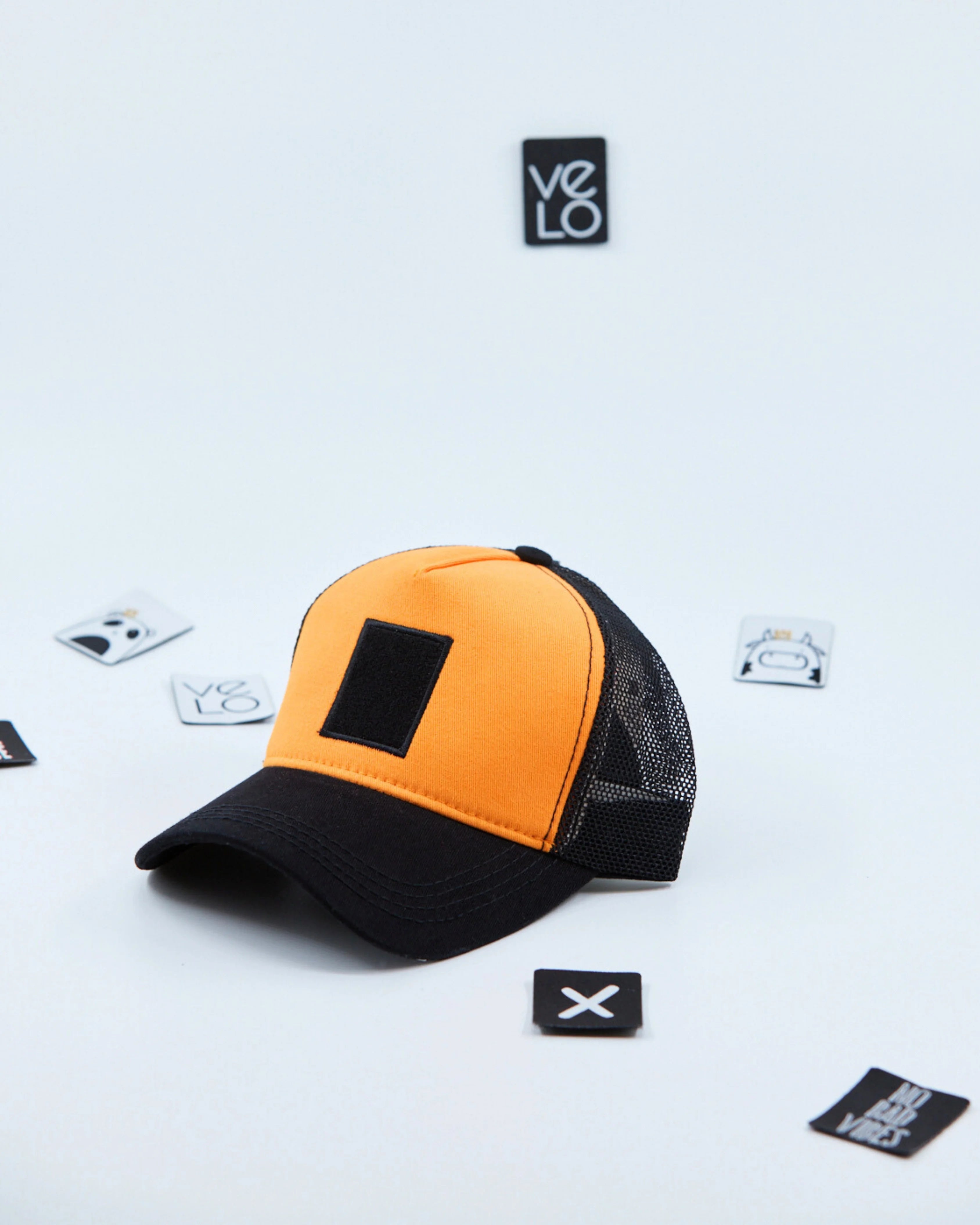 Side view of Orange and Black Customisable Trucker Cap