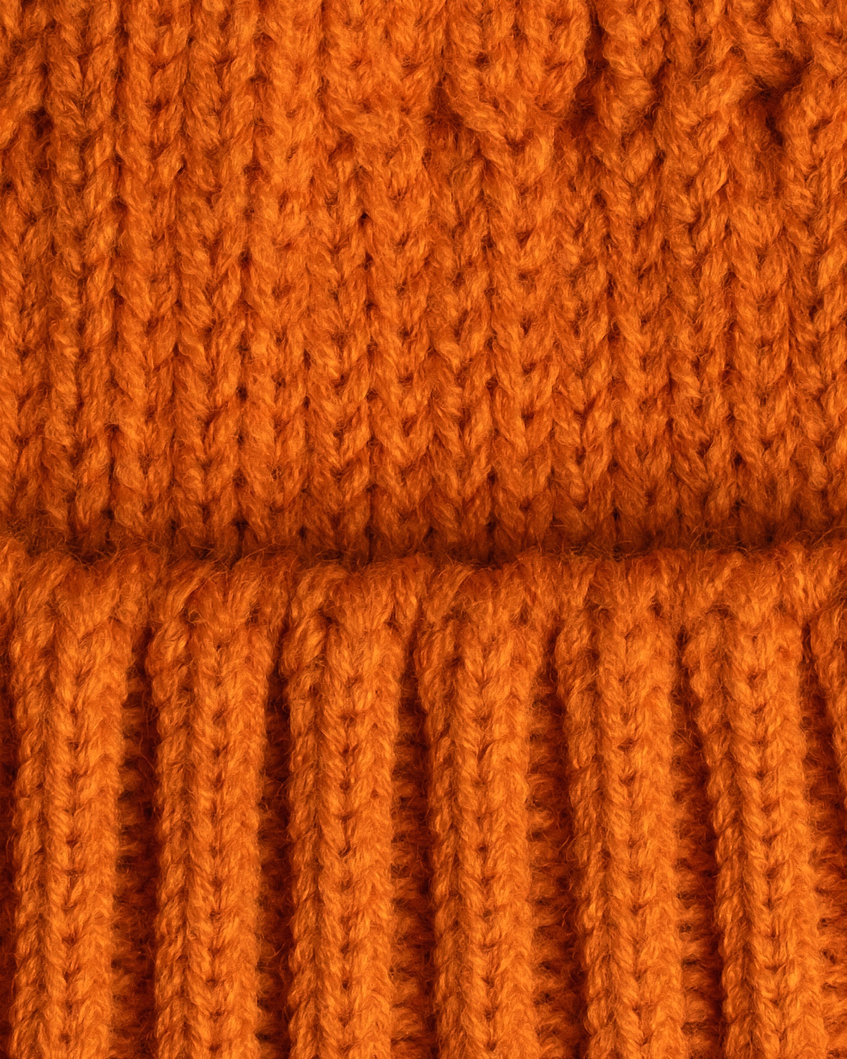 close look of orange fisherman beanie