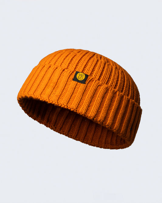 orange fisherman beanie on a white background