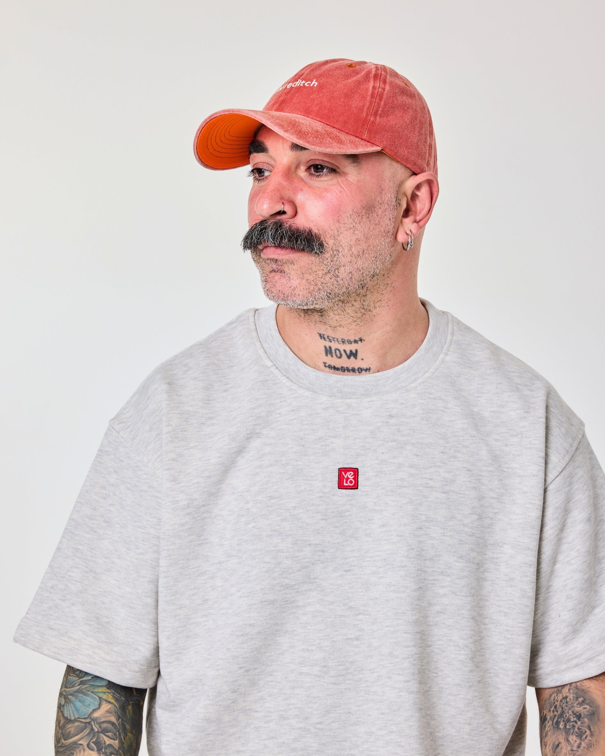 side view of a man wearing Shoreditch Orange Washed Cap