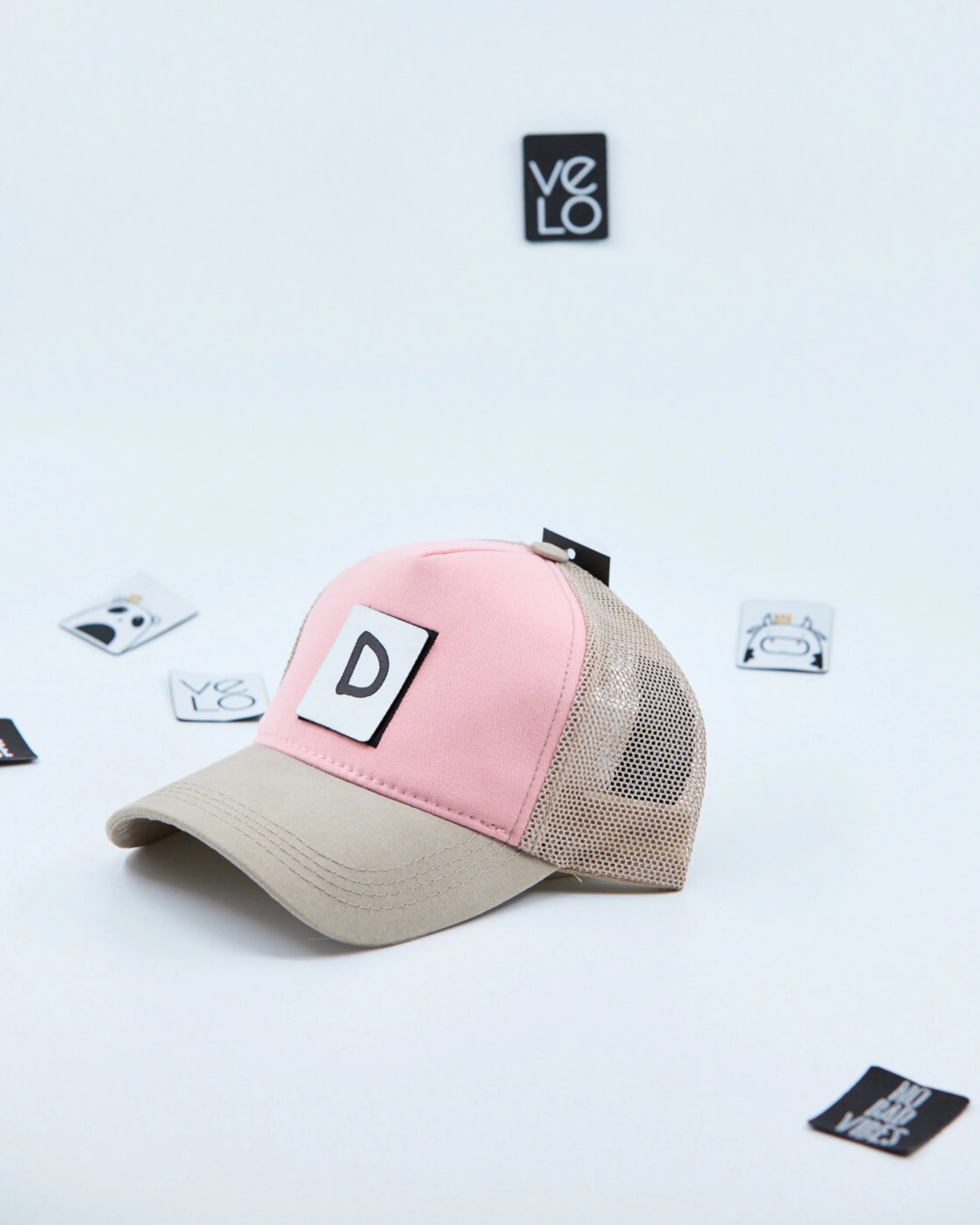 Side view of Pink and Beige Customisable Trucker Cap with patches
