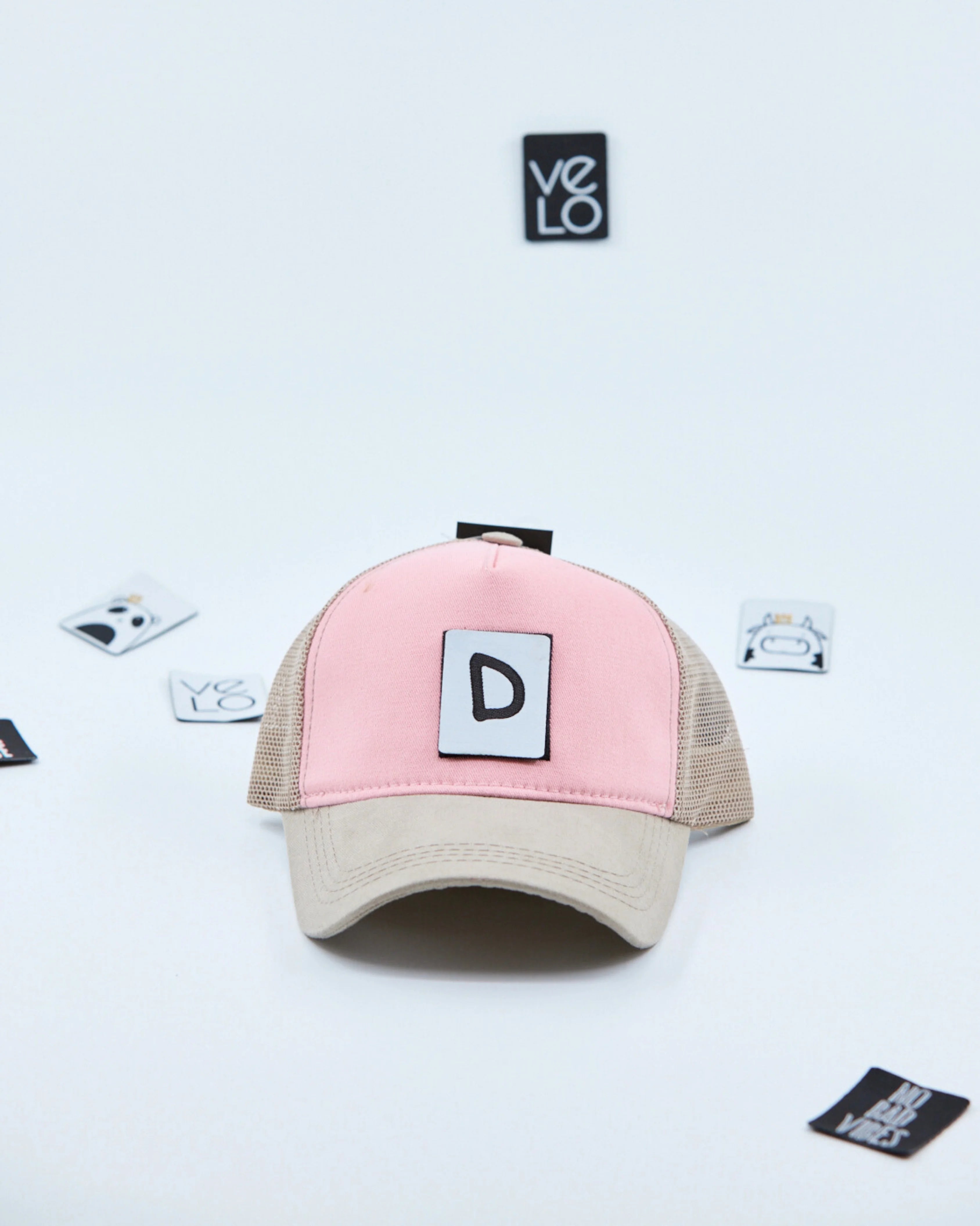 Front view of Pink and Beige Customisable Trucker Cap with patches