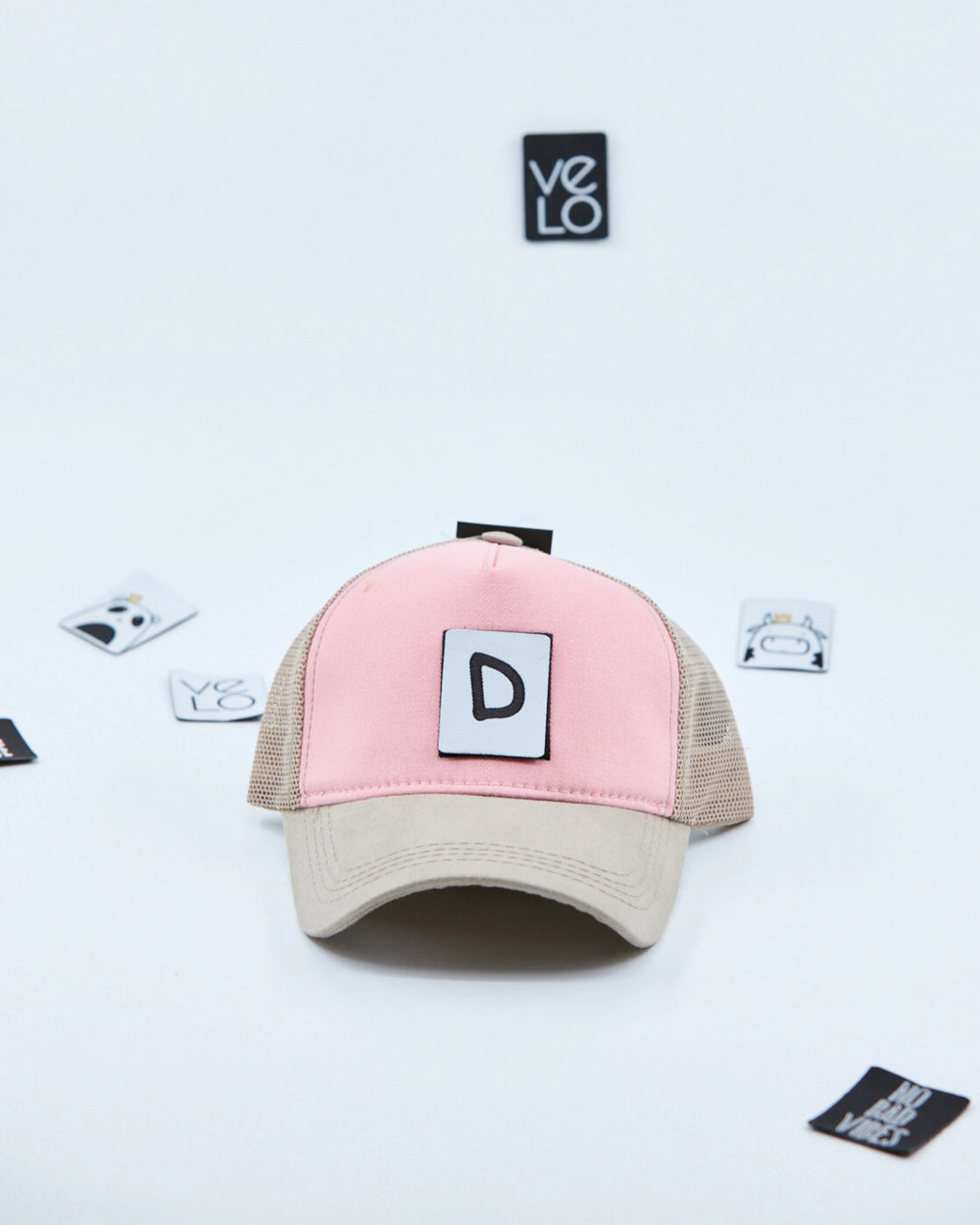 Front view of Pink and Beige Customisable Trucker Cap with patches