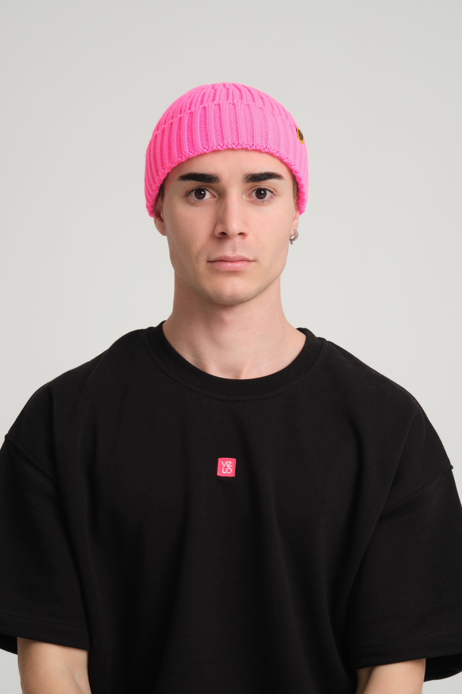 front view of a man wearing Fuchsia Fisherman Beanie